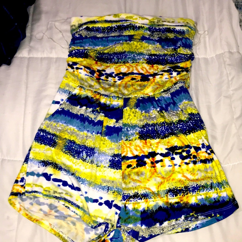 Multi color romper, brand new with tags. Size XL